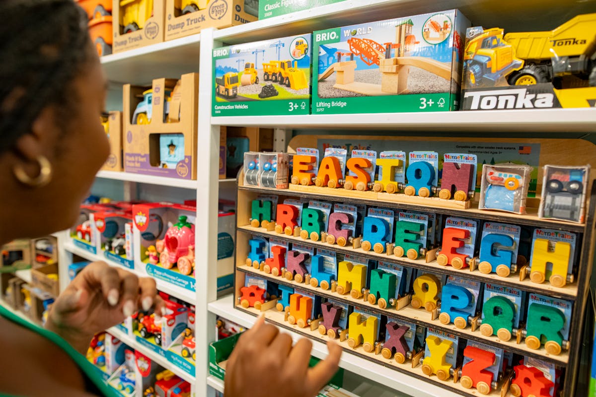 Shopper browsing plush toys in a specialty toy store